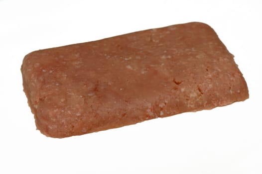 Prepped and seasoned ground meat sits on a clean surface, awaiting transformation into a savory dish for dinner.