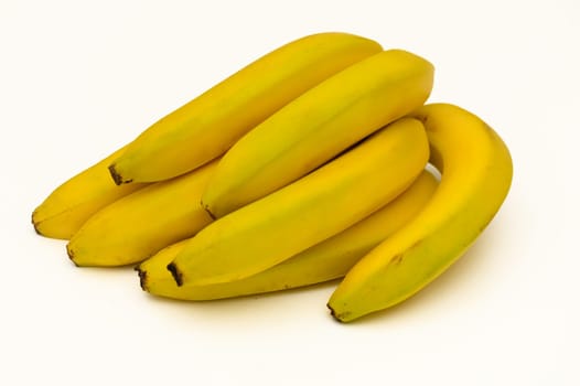 Bright yellow bananas grouped together showcase their natural beauty, inviting a delicious snack or dessert.