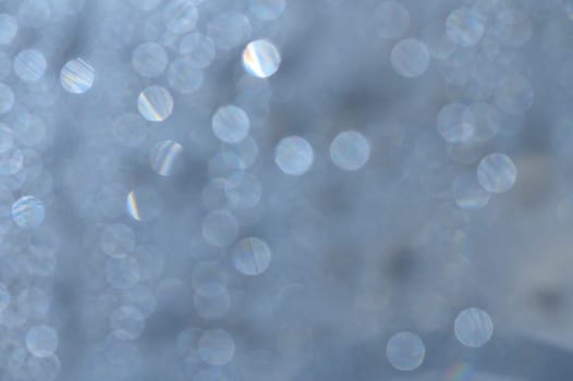 Sunlit droplets dance on calm water, casting enchanting reflections that evoke tranquility.
