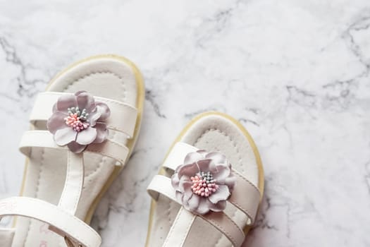 Baby girl pink sandals on white background. Baby fashion pair pink sandals shoes for the toddlers feet
