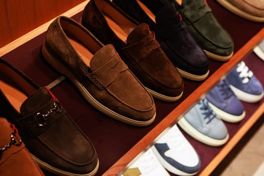 Elegant men's leather shoes on store shelves in mall. Shopping center. Men's clothing store. Accessories for Man. Fashion and style.