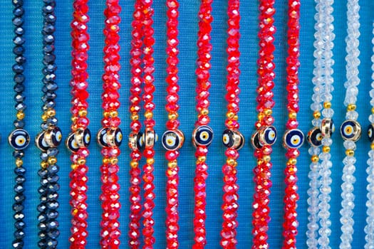 Vibrant rows of glass beads in various colors showcased for customers.