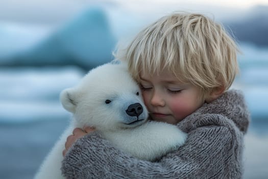 A little boy tenderly hugs a polar bear cub against the backdrop of ice and snow.