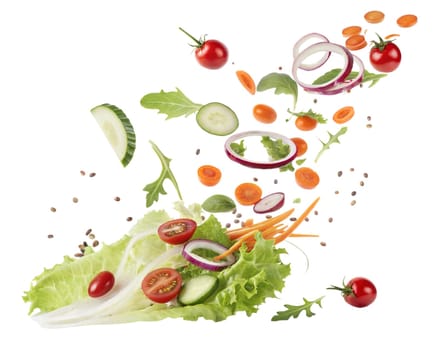 A bowl of fresh vegetable salad with flying ingredients, including lettuce, cucumber, tomatoes, onion, and carrots, isolated on white background. Perfect for healthy eating concepts.