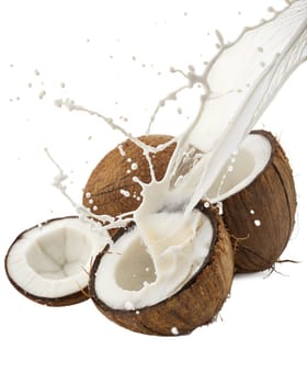 Cracked open coconut with fresh coconut milk splashing, isolated on white background. Perfect for tropical food, exotic drinks, and healthy diet concepts.