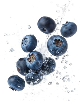 Juicy blueberries splashing in water, isolated on white background. Perfect for healthy eating, fresh fruit, and diet concepts.