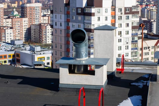 A prominent chimney is situated atop a tall building, with an expansive cityscape visible in the background, blending urban elements harmoniously