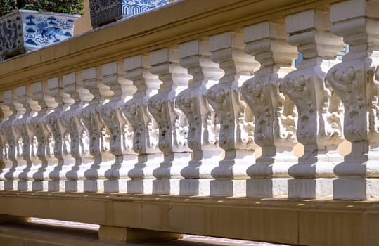 Bangkok, Thailand - Mar 02, 2025 - The morning light shining through Row of Vintage concrete railings or Ornate cast stone balustrades in classical style. Architectural element of precast concrete, use it as your Wallpaper, Poster and Space for text.