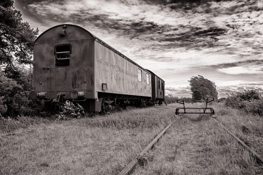 discarded railway wagon on a disused abandoned railway line