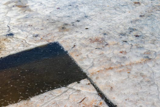 Lake covered with thawed ice