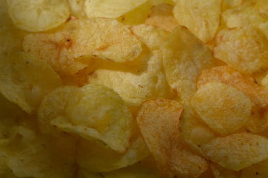 Crunchy textures and golden hues fill the bowl, inviting snack enthusiasts to indulge in a savory treat.