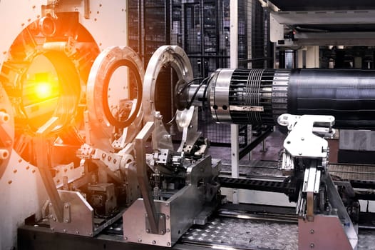High-tech machinery performs precise assembly work in an industrial setting, showcasing the automated production process.