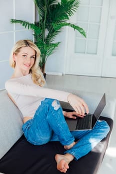 woman working on laptop learning from home online