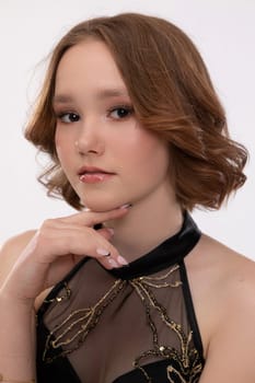 A chic portrait presenting a young woman with a stunning and elegant styling, capturing her fascinating expression