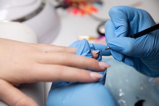 The image highlights intricate nail art, showcasing skilled techniques and stylish designs that catch the eye