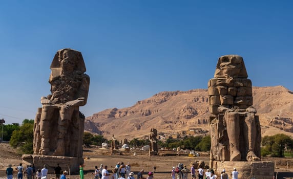 Luxor, Egypt - 2 November 2024: The Colossi of Memnon are two massive stone statues of the Pharaoh Amenhotep III.