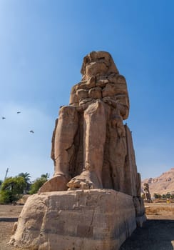 The Colossi of Memnon are two massive stone statues of the Pharaoh Amenhotep III, located on the West Bank of Luxor, Egypt.