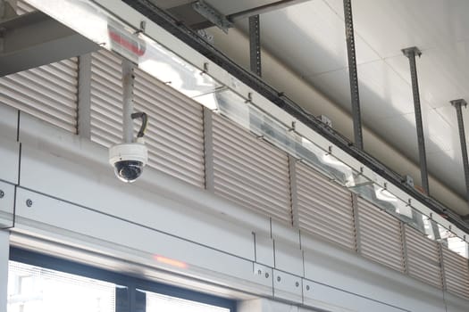 A security camera is positioned on the ceiling, overseeing the area.