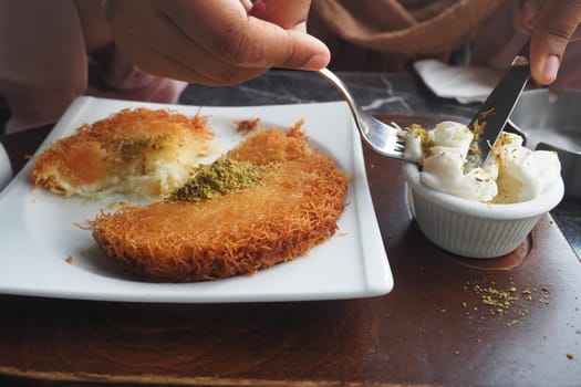 Turkish dessert kunefe, kunafa, kadayif with pistachio .