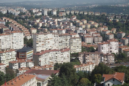 Numerous residential buildings are visible in the suburban landscape.