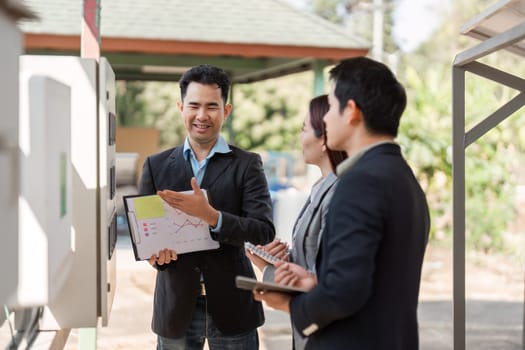 A team of diverse business professionals sharing insights and strategic ideas in the realm of sustainable energy management, highlighting collaboration and engagement.