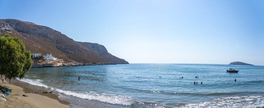 August 26 2024; Idyllic Kantouni Beach on summer day with swimmers in water..