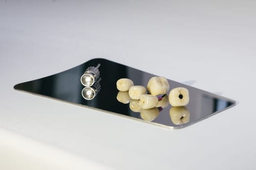 Zirconium crown and zirconium hybrid abutment. Zirconium dental crown artificial chewing tooth with orthopedic screwdriver.