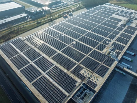 aerial view of a warehouse roof filled with solar panels