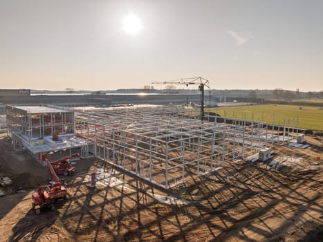 DEVENTER, NETHERLANDS - MARCH 8, 2025: Aerial view of the construction of a new warehouse
