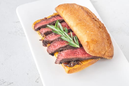 Crispy ciabatta filled with melted cheese, tender steak, sweet onions, and fresh rosemary