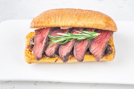 Crispy ciabatta filled with melted cheese, tender steak, sweet onions, and fresh rosemary