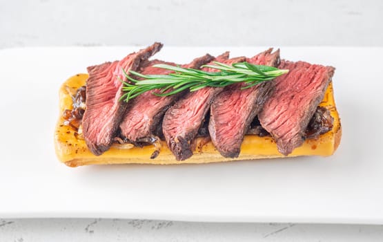 Crispy ciabatta filled with melted cheese, tender steak, sweet onions, and fresh rosemary