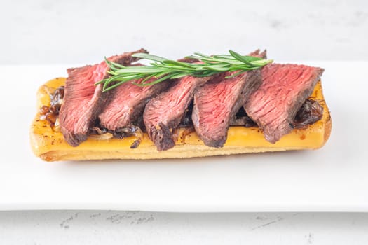 Crispy ciabatta filled with melted cheese, tender steak, sweet onions, and fresh rosemary