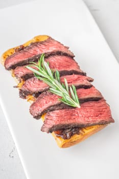 Crispy ciabatta filled with melted cheese, tender steak, sweet onions, and fresh rosemary