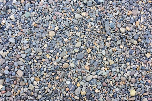 Gravel stones texture background with shallow depth of field.