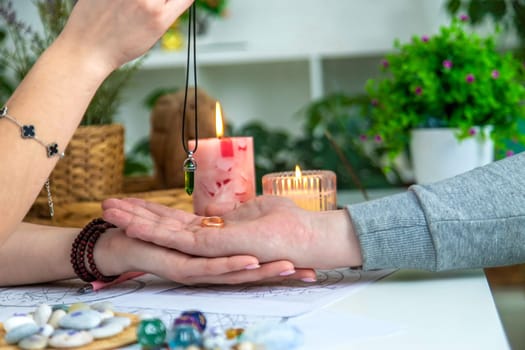 A woman fortune teller speaks to a man. Fortune telling, magic. Bright fortune teller