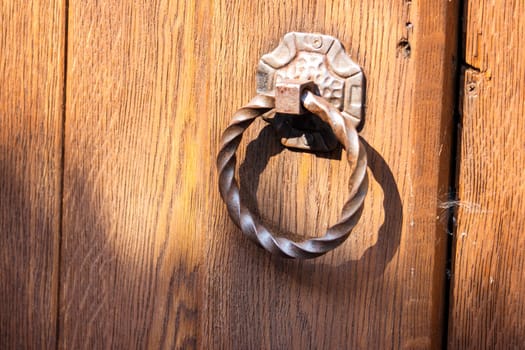 beautiful vintage round handle on wooden doors , summer
