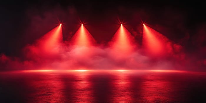 Bright red lights illuminate a fog-filled stage, setting a captivating mood for an upcoming performance. The reflective surface enhances the overall ambiance, inviting anticipation.