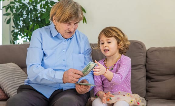 Old woman with her granddaughter. Selective focus. People,