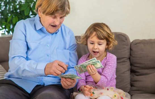 Old woman with her granddaughter. Selective focus. People,