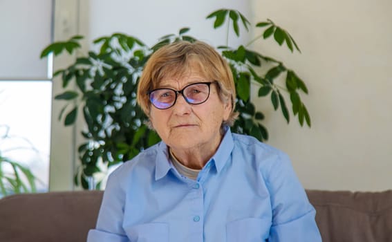 Old woman with glasses portrait. Selective focus. people.