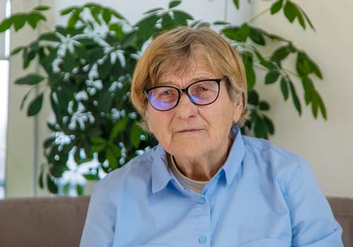 Old woman with glasses portrait. Selective focus. people.
