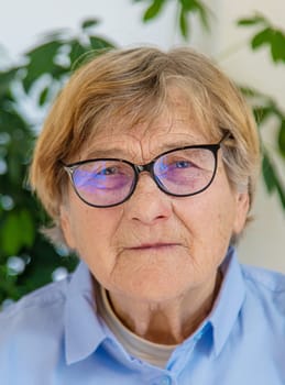 Old woman with glasses portrait. Selective focus. people.