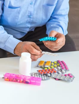 Old woman with medicine. Selective focus. people,