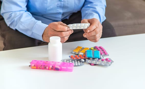 Old woman with medicine. Selective focus. people,