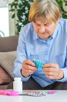 Old woman with medicine. Selective focus. people,