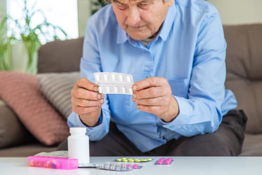 Old woman with medicine. Selective focus. people,