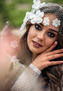 portrait of a young woman with floral veil, showcasing natural beauty, smooth skin texture, and elegant features in a romantic and artistic style, emphasizing timeless aesthetics and delicate .High quality photo