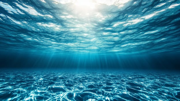 Peaceful underwater seascape background showing sunlight filtering through clear blue water surface, creating rays and patterns on sandy ocean floor