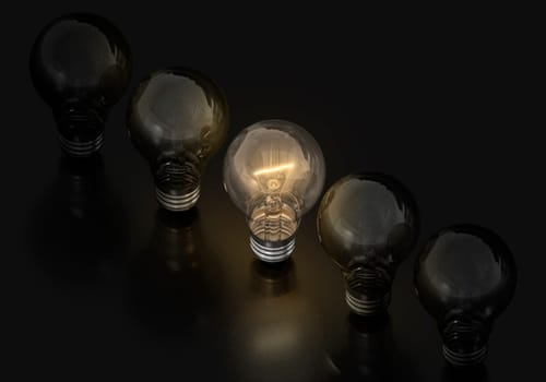 Light bulb on and off on a black background, creative ideas concept